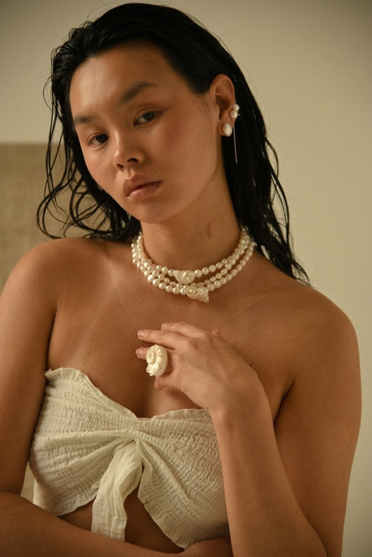 SirenCore pearl and shell choker worn around the neck