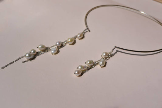 BORA BORA statement necklace with cascading silver chains and natural drop-shaped pearls on a rigid silver wire base