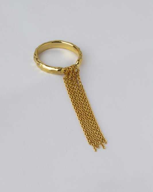 gold plated chain ring fringe detail on hand close up