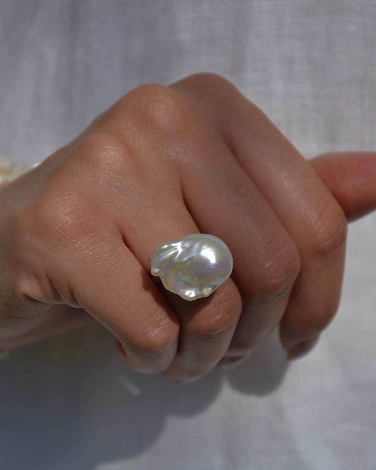 Natural baroque pearl set in a sculptural 925 sterling silver ring