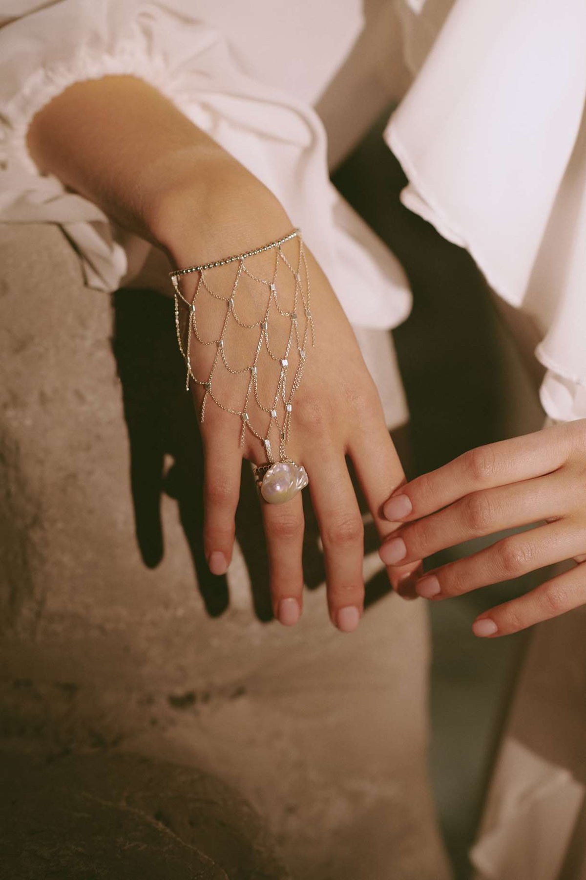 Sterling silver baroque pearl ring worn on the hand