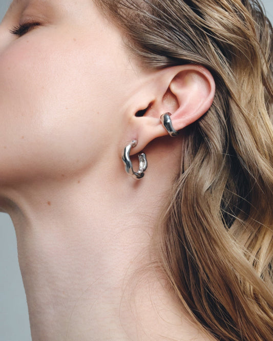silver hoop earrings worn on ear minimal styling