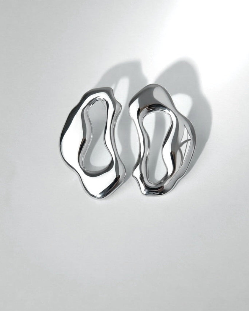 sculptural silver statement earrings ripple shape
