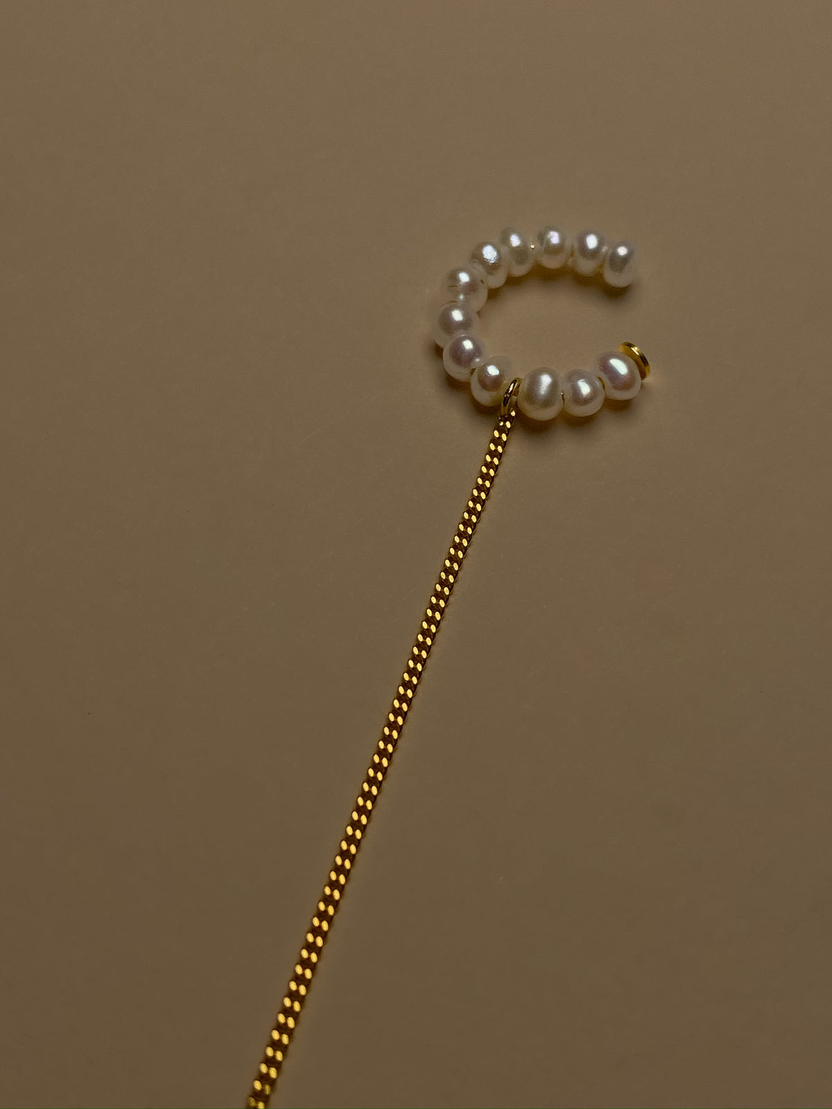 Pearl ear cuff with 24K gold-plated sterling silver and a delicate chain