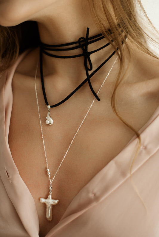 Tear Drop pearl pendant on a black velvet cord worn around the neck