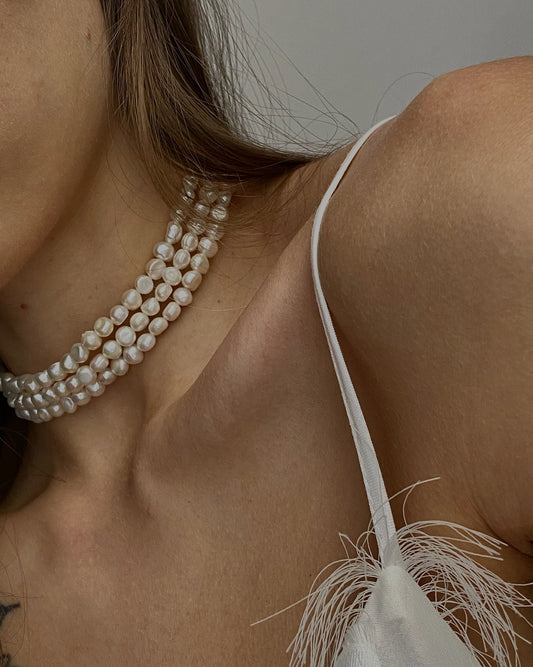 TOCCOA triple pearl choker featuring three strands of natural pearls in organic shapes