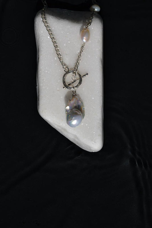 Close-up of the large baroque pearl and two freeform pearls on the MOROCCO silver chain necklace