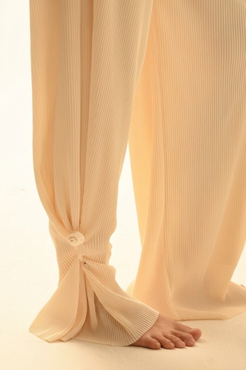 MARE ocean shell pin styled on a pair of lightweight trousers
