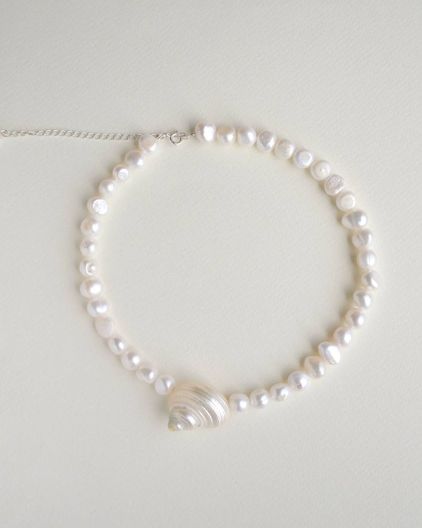 SirenCore pearl choker with a single natural ocean shell and sterling silver details
