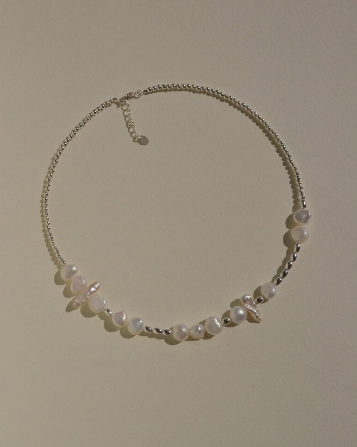 Morse Code pearl choker with natural baroque pearls and sterling silver beads spelling “I love you”