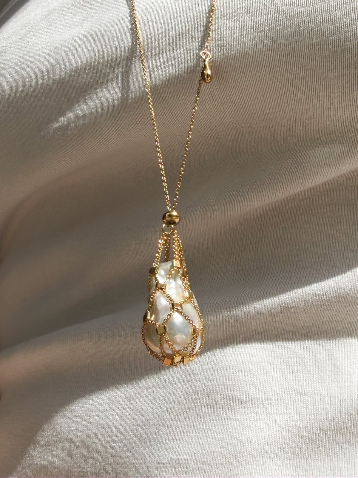 24K gold plated sterling silver Hidden Pearl pendant with a natural baroque pearl