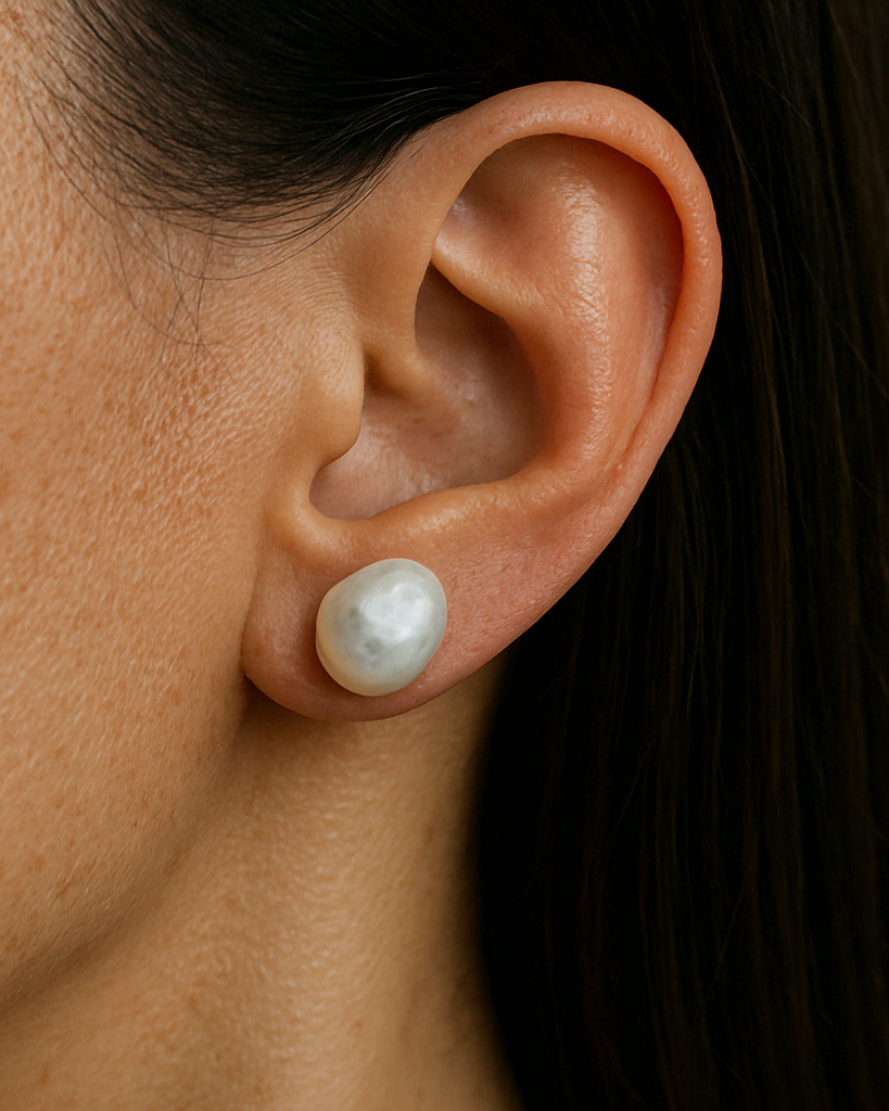 pearl stud earrings worn on ear minimalist bridal look