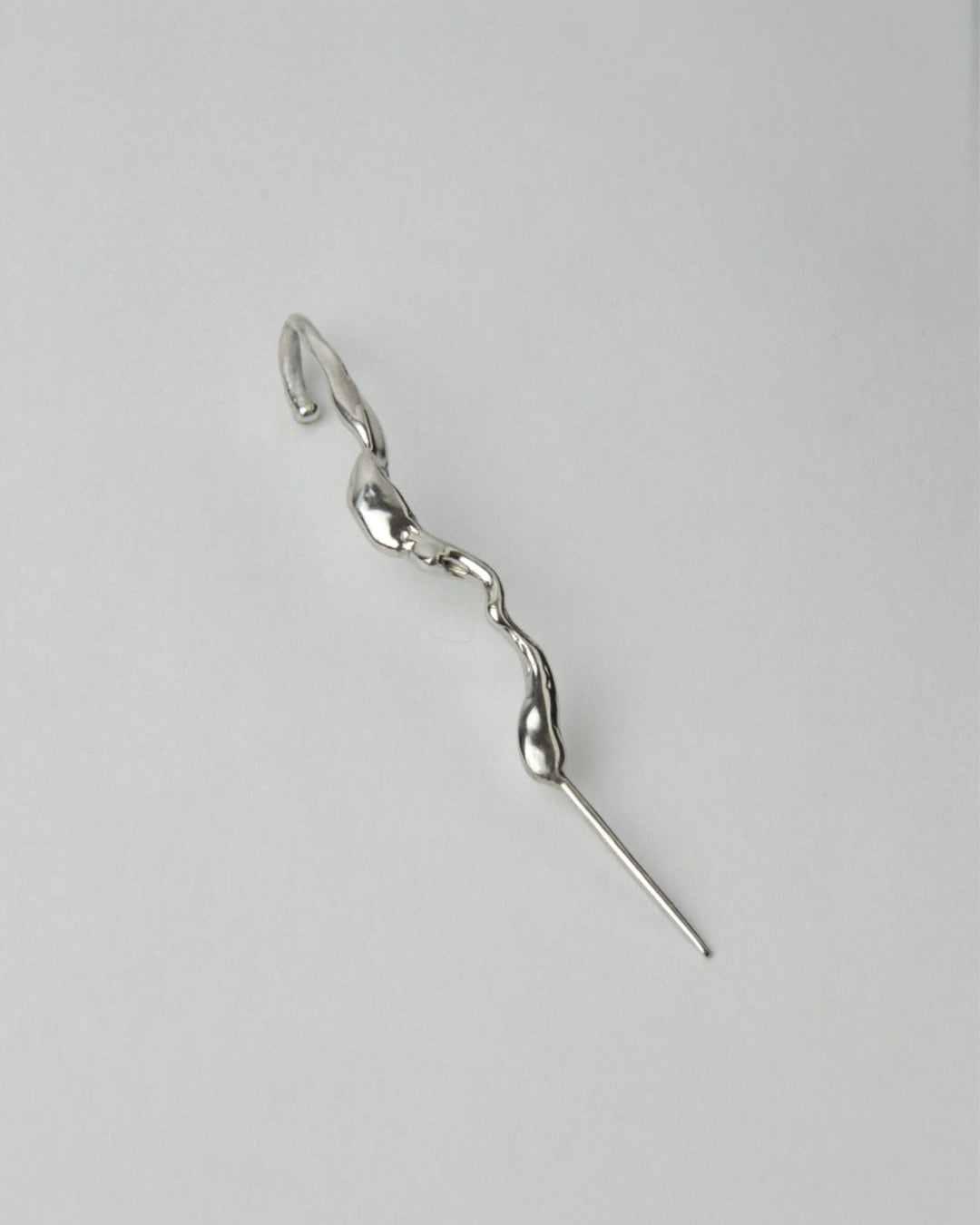 Sculptural sterling silver ear cuff earring, fluid organic shape mono earring, minimalist modern jewelry design
