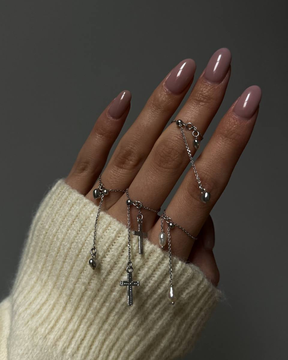 Nicole adjustable sterling silver charm ring worn on a hand