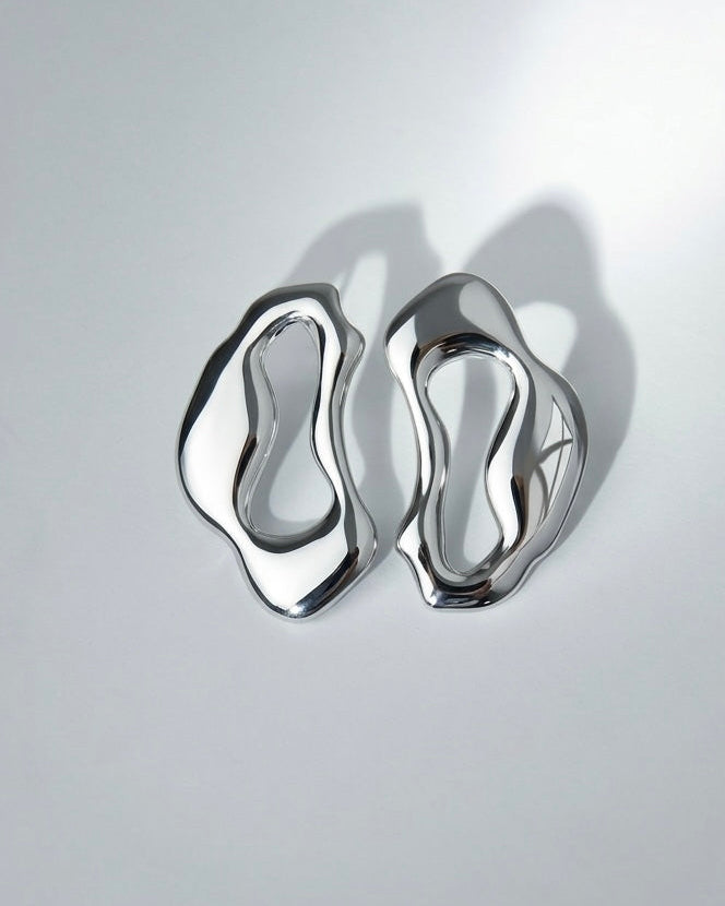 sculptural silver statement earrings ripple shape